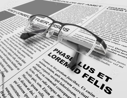 Photo: Eye glasses and newspaper Eye glasses and newspaper