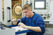 Foto: worker measuring detail worker measuring detail