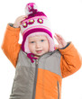 Adorable toddler girl dressing winter jacket and hat