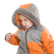 Adorable toddler girl sit in winter jacket with hood on head
