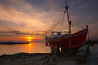 The famous red boat of Mykonos at sunset. Greece.