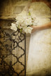 bride and groom's hands holding wedding bouquet