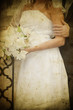 bride and groom's hands holding wedding bouquet