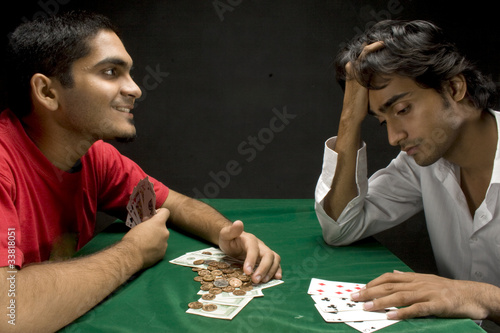 Guys playing poker