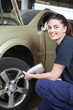 Happy Woman Mechanic Tire Change