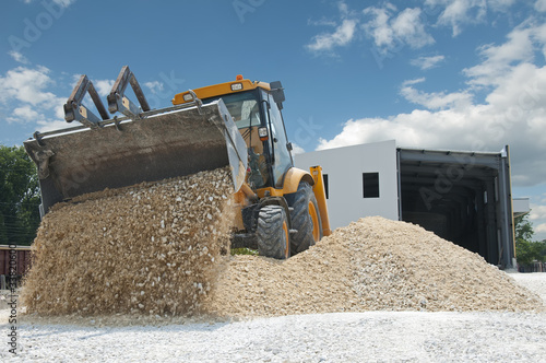 Photo: Excavator unload gravel Excavator unload gravel
