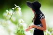 Beautiful young lady and flowers