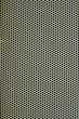 White metal plate with many small circular holes