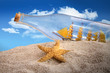Ship in a bottle in a pile of sand