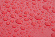 water droplet on red surface