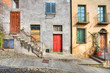 Wooden multicolored doors in the house in Saluzzo. Wooden multicolored doors in the house in Saluzzo.