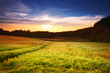 A sunset photo of road and countryside A sunset photo of road and countryside