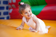 Happy child jumping on trampoline outdoors