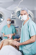 Surgeon nursing the patient