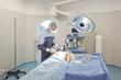Young doctor performing operation