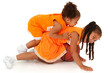 Two Adorable African-Hispanic Girls Playing Basketball