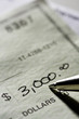 Photo: Writing a check Writing a check