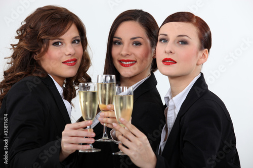 Photo: Women celebrating with a glass of wine Women celebrating with a glass of wine