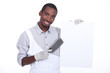 Chef with a cleaver and a white board ready for text