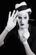 face and hands of mime with dark make-up face and hands of mime with dark make-up