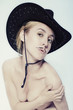 Naked women with mustache wearing cowboy hat