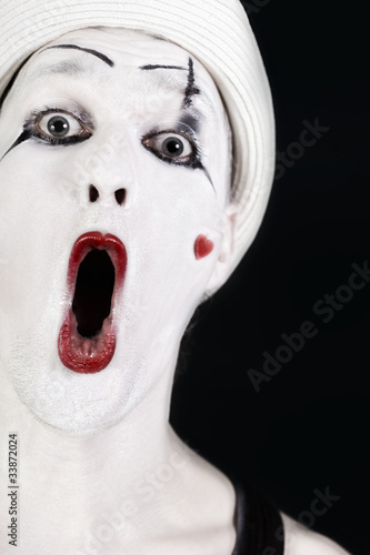 Photo: Funny screaming mime in white hat Funny screaming mime in white hat