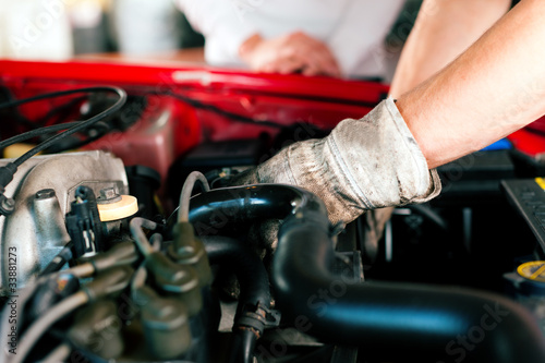 Photo: Car mechanic in repair shop Car mechanic in repair shop