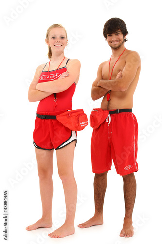 Photo: Boy and Girl Teenager Lifeguards in Uniform with clipping path. Boy and Girl Teenager Lifeguards in Uniform with clipping path.