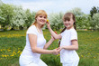 girl with mother in spring park