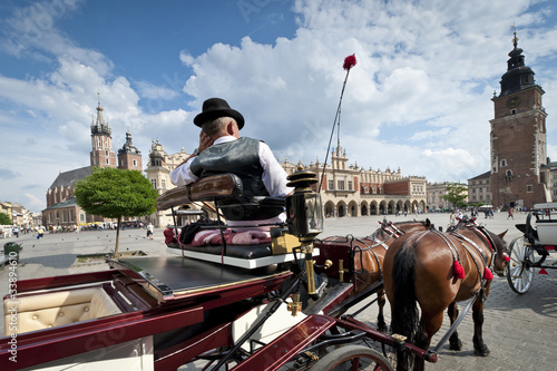 Photo: Cabby man on the Old Town square in Krakow, Poland Cabby man on the Old Town square in Krakow, Poland