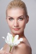 Beautiful blond woman with white lily flower Beautiful blond woman with white lily flower