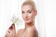 Beautiful blond woman with white lily flower Beautiful blond woman with white lily flower