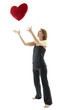 Woman throws heart in the air