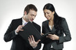 Photo: businessman and businesswoman looking at portfolio businessman and businesswoman looking at portfolio