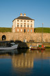 Photo: house reflections and boat house reflections and boat