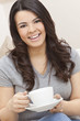 Beautiful Hispanic Latina Woman Drinking Tea or Coffee