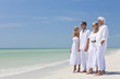Two Couples Family Generations Holding Hands on Tropical Beach