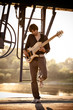 bass guitarist at sunset