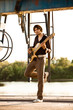 bass guitarist at sunset