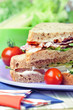 Photo: Sandwiches with bacon, and veg, close-up shot Sandwiches with bacon, and veg, close-up shot