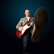 rocker with guitar and foot