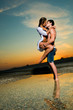 Couple on the beach at sunset