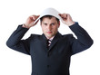 A businessman is holding a blank sheet of paper above his head A businessman is holding a blank sheet of paper above his head