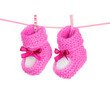 pink baby booties blue isolated on white