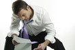 Photo: businessman looking at bad business news businessman looking at bad business news