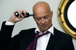 Desperate businessman puts gun to his head
