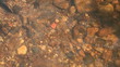 Lake bottom covered with a pebble.