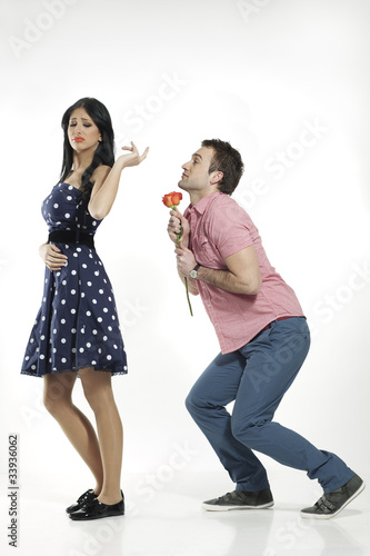 Photo: pretty woman refusing apologies from pleading boyfriend pretty woman refusing apologies from pleading boyfriend