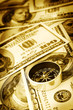 Close up of compass and money Close up of compass and money