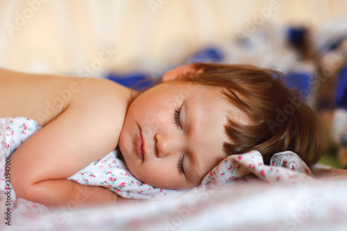 Photo: bright portrait of adorable sleeping baby bright portrait of adorable sleeping baby